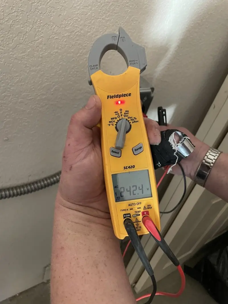 Voltage testing with clamp meter during Circuit Breaker Repair in Storm Lake
